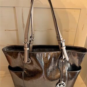 PRICE DROP !!!!Michael Kors Silver Jet Set Tote .Great  statement bag!!